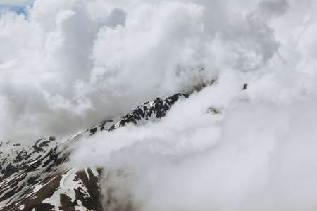 Mountains landscape aerial view of rocky peaks with clouds. Lifestyle active travel. Serene scenery wild nature calm atmosphere.の写真素材