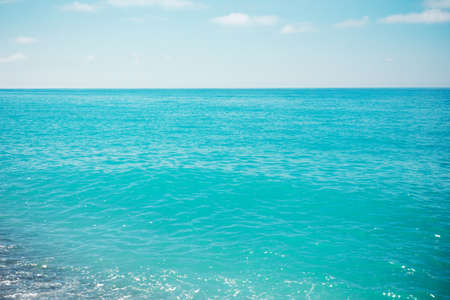 Panorama of the turquoise sea from the coastline. View of a tropical paradise of places, blue waves against a sky background on a clear day. Concept travel, leisure, lifestyle.の写真素材