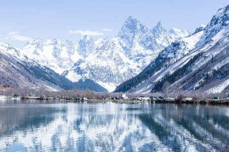 Lake and high mountains in clear weather, traveling and hiking.の写真素材