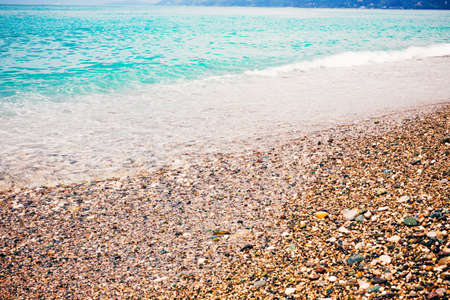 The turquoise sea with a tropical beach. Coastline of the ocean in the summer, active holidays in paradise resorts, concept travel lifestyle.の写真素材