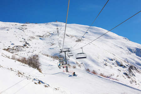 Landscape winter panorama of the mountain with ski slopes. The concept of a vacation is snowboarding and skiing, enjoying the alpine mountain scenery. The purpose of using mountains, lifestyle, snowboarding, adventure, sports and travel.の写真素材