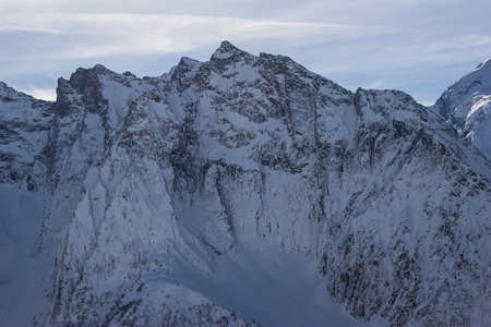 Winter mountains and peaks on a clear day. Caucasus. Landscape winter views in the highlands. The concept of travel and leisure, winter sports, lifestyle, adventure.の写真素材