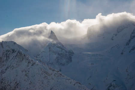 Winter mountains and peaks on a clear day. Caucasus. Landscape winter views in the highlands. The concept of travel and leisure, winter sports, lifestyle, adventure.の写真素材