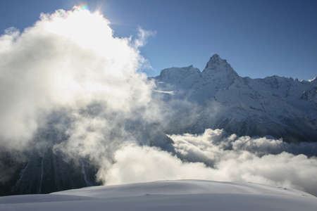 Winter mountains and peaks on a clear day. Caucasus. Landscape winter views in the highlands. The concept of travel and leisure, winter sports, lifestyle, adventure.の写真素材