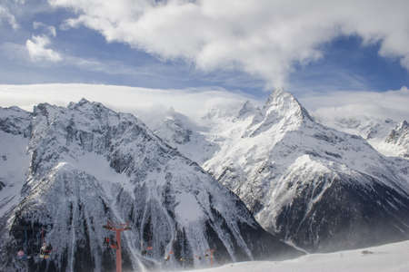Winter mountains and peaks on a clear day. Caucasus. Landscape winter views in the highlands. The concept of travel and leisure, winter sports, lifestyle, adventure.の写真素材