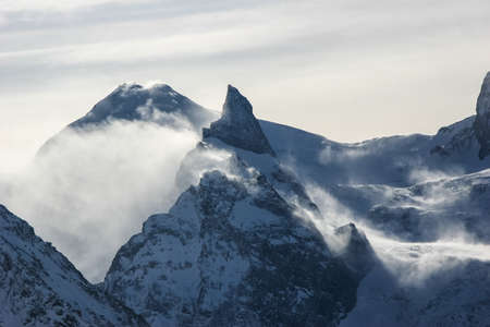 Winter mountains and peaks on a clear day. Caucasus. Landscape winter views in the highlands. The concept of travel and leisure, winter sports, lifestyle, adventure.の写真素材