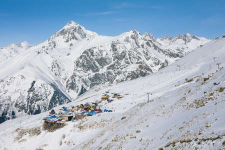 Landscape winter panorama of the mountain with ski slopes. The concept of a vacation is snowboarding and skiing, enjoying the alpine mountain scenery. The purpose of using mountains, lifestyle, snowboarding, adventure, sports and travel.の写真素材