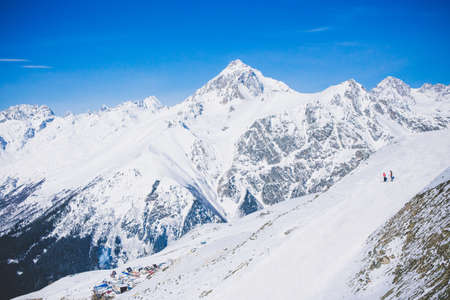 Landscape winter with ski slopes. Snowboarding and skiing, enjoying the alpine mountain scenery. Lifestyle snowboarding, adventure, sports and travel.の写真素材