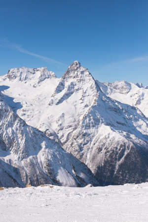 Landscape winter with ski slopes. Snowboarding and skiing, enjoying the alpine mountain scenery. Lifestyle snowboarding, adventure, sports and travel.の写真素材