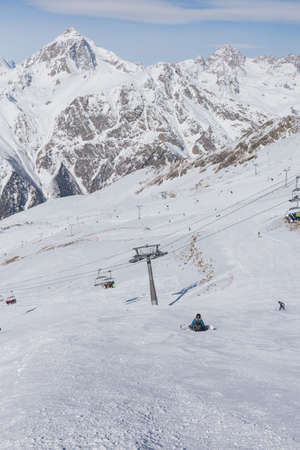 Landscape winter with ski slopes. Snowboarding and skiing, enjoying the alpine mountain scenery. Lifestyle snowboarding, adventure, sports and travel.の写真素材