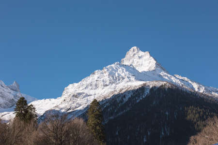 Winter mountains with high peaks. Snowboarding and skiing, enjoying the snowy landscapes. Lifestyle snowboarding, adventure, sports and travel.の写真素材