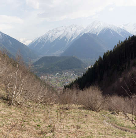 Mountains green landscape with blue sky and white clouds. Lifestyle is active, hiking, tourism. Picturesque landscapes of the Alpine mountains in the summer season.の写真素材