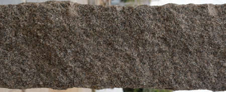 Rock background texture. A piece of granite rocky uneven rock. Nature detail material stone rough surface abstract texture.の写真素材