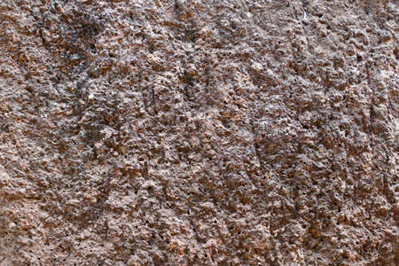 Rock stone texture. Grunge gray textured wall background surface of stony, porous rock backdrop with rough abstract texture. Material nature detail of rocks.の写真素材