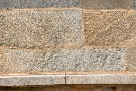 Stone brick wall tile texture. Modern slate outdoor decorative rocks. Slate textured of general layout of stones masonry with mixed block various shapes and sizes.の写真素材