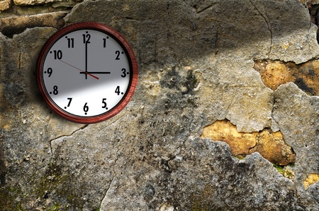  clock on the old wall cement in the late afternoon.