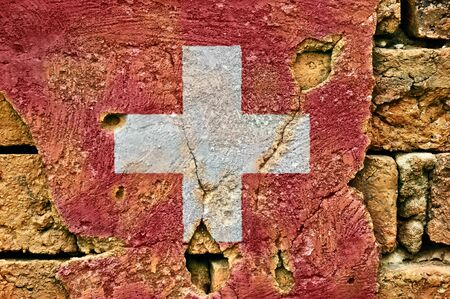 Grunge flag of Switzerland on old wall background.の写真素材