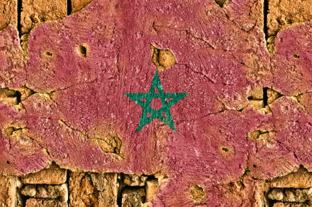 Grunge flag of Morocco on old wall background.の写真素材