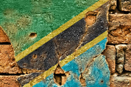Grunge flag of Tanzania on old wall background.の写真素材