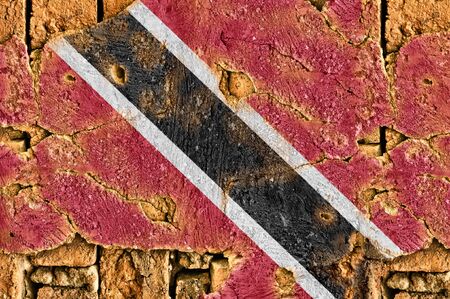 Grunge flag of Trinidad and Tobago on old wall background.の写真素材