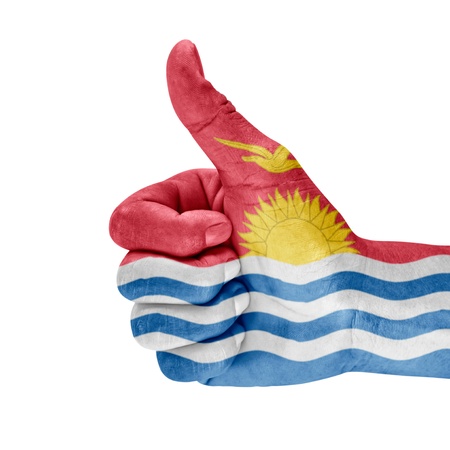 Flag of Kiribati on thumb up hand with a white background の写真素材