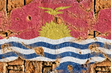 Grunge flag of Kiribati on old wall background の写真素材