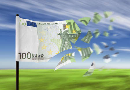 An euro banknote paper money falling into pieces in the wind.の写真素材