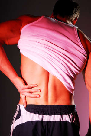 Strong Backache. Man gripping illness part of body.