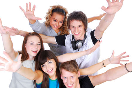 Group of joyful young people with the hands stretched upwards on a white backgroundの写真素材