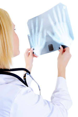 Back view portrait of Female doctor looking on medical x-ray - isolated on white