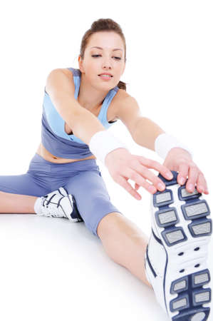 physical stretching of young sporting attractive girl - isolated