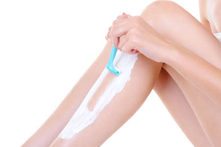 depilation with razor on the female legs - part of leg close-up 