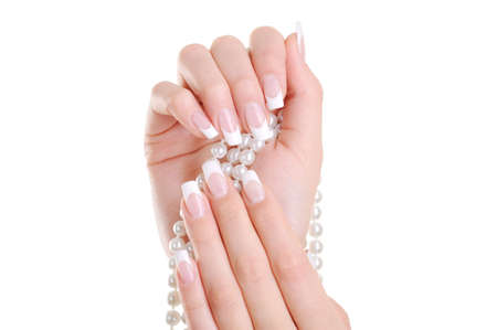 Beautiful elegant female hand with beauty french manicure over white backgroundの写真素材