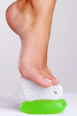 Young woman's barefoot  foot with the pedicure toolsの写真素材