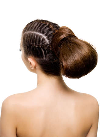 Back view of a beauty  hairstyle from pigtails. On white background