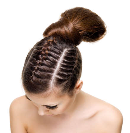 High angle view of a woman's head with beauty pigtails. On white background