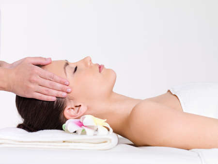 Massage for the face of young beautiful woman - horizontalの写真素材