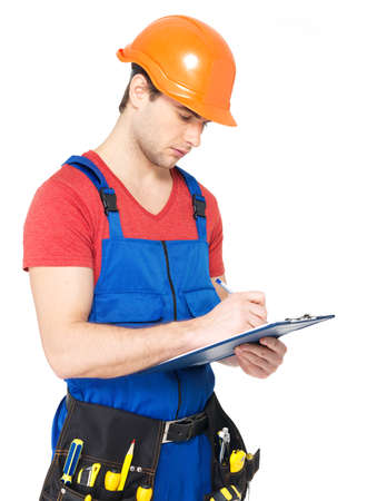 Portrait of worker with tools, planning and writing the note isolated on  white background