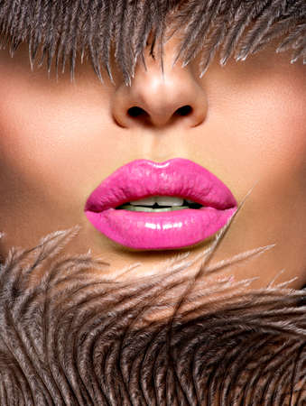  Closeup Beautiful female lips with pink  lipstick.  Glamour fashion bright gloss make-up.の写真素材