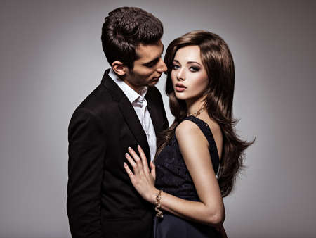 Studio portrait of young beautiful flirting  couple in love