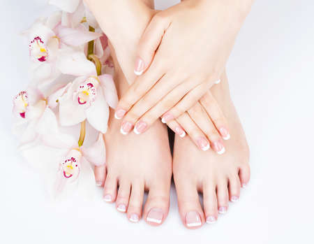 Closeup photo of a female feet at spa salon on pedicure and manicure procedure - Soft focus imageの写真素材