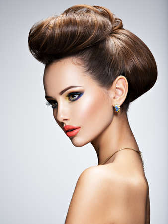 Beautiful woman with style hairstyle posing at studioの写真素材