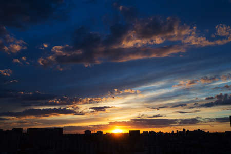 Beautiful sunrise over big city with amazing clouds