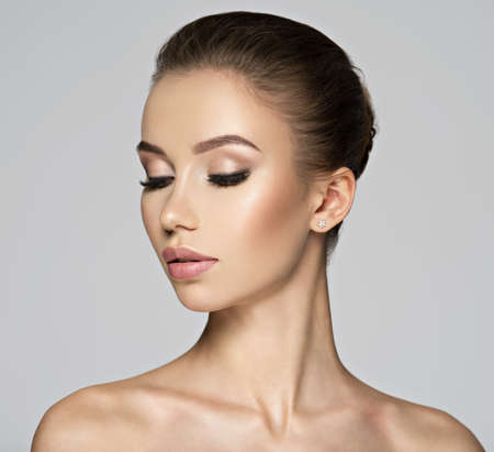 Beautiful young woman - profile view. Beauty treatment concept. Portrait of a pretty  caucasian girl...