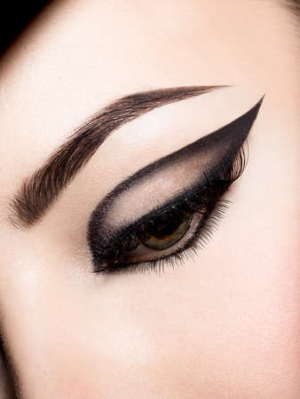 Closeup female eye with beautiful fashion bright makeupの写真素材