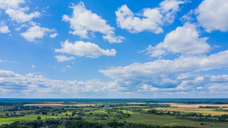 Aerial view over beautiful suburb in  wide valley, in the summer.  Top view to the small village with a beautiful green landscape.の写真素材
