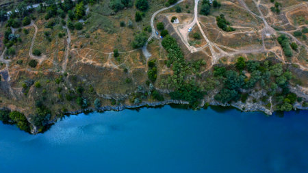 Beautiful summer landscape over the river with a drone. Beautiful azure lake with a rocky, steep bank, drone shooting. Aerial view on a blue lake.の写真素材