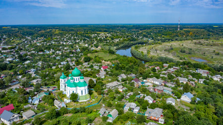 Bird's eye view of an old church in a village on a beautiful summer day. Picture from above an...