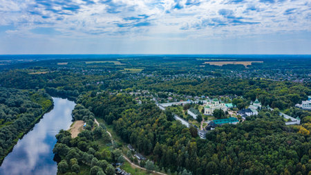 Bird's eye view of an old church in a village on a beautiful summer day. Picture from above an...