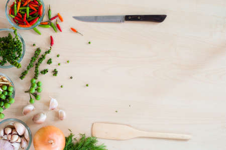Flat lay of knife, paddle and popular Thai herbal and wood backgroundの写真素材